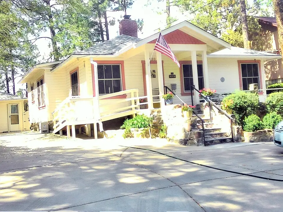 Pinecrest-neighborhood home in Prescott with ponderosa pines behind it